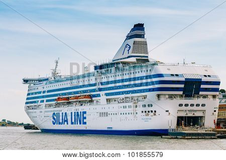 Modern ferry boat - Silja Line - at pier awaiting loading cargo