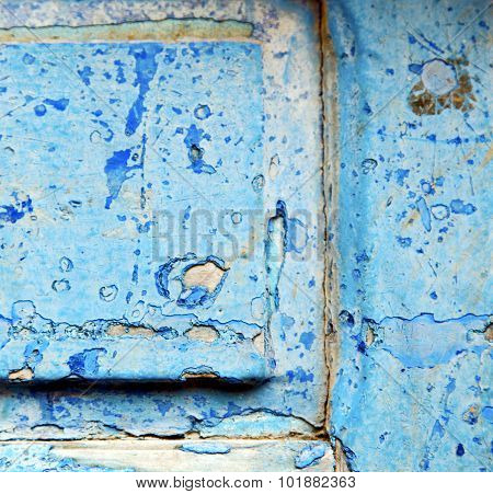 Stripped Paint In The Blue Wood Door And Rusty Nail