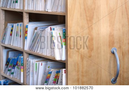 Medical record files on shelf of archive files cabinet. Concept photo for health care. copy space.