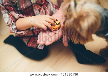 Mother with daughter standing in kitchen