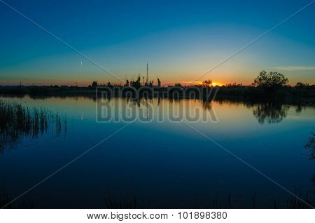 Sunset over calm lake