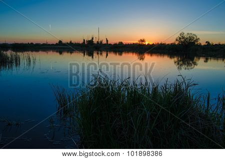 Sunset over calm lake