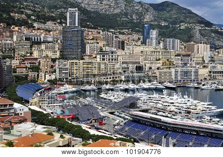 LA CONDAMINE, MONACO - MAY 16: Aerial view of the Port Hercules on May 16, 2015 in La Condamine, Monaco, during the preparations for the 73 Monaco Grand Prix, and Monte Carlo in the background