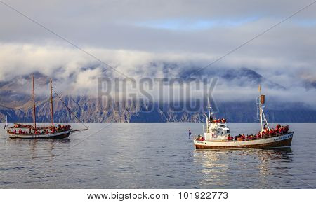 Husavik, Iceland - September 10, 2013: Whale watching ships in the Skjalfandi Bay in Northern Iceland