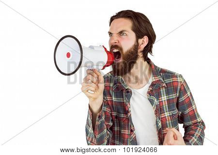 Handsome hipster shouting through megaphone on white background