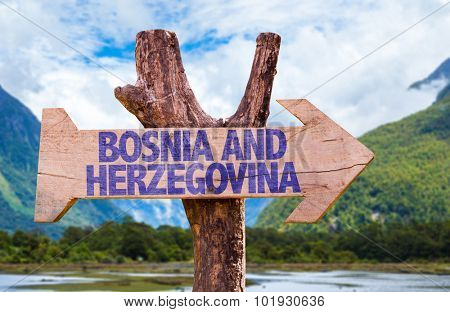 Bosnia and Herzegovina wooden sign with landscape on background