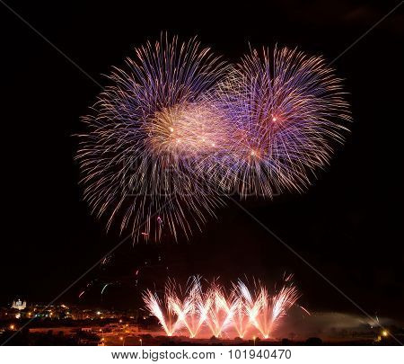 Colourful fireworks isolated in dark background close up with the place for text, Malta