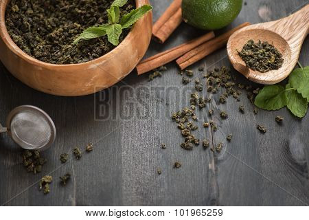 tea composition with cinnamon sticks, lemons