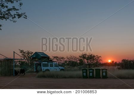 ETOSHA NATIONAL PARK NAMIBIA - JUNE 26 2017: View of a camping site at the Olifantsrus Rest Camp in the Etosha National Park at sunrise
