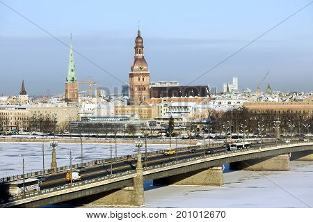 LATVIA, RIGA, JANUARY, 10, 2016 -  Panorama view of Riga city, capital of Latvia.  View of the Stone bridge over the Daugava river in winter, Riga, Latvia