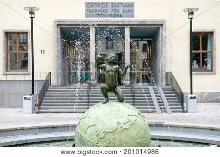 STOCKHOLM, SWEDEN - JULY 4, 2017: The Eastman institute and the Eastman fountain in Stockholm.  The institute was donated by George Eastman to provide free dental care to children.