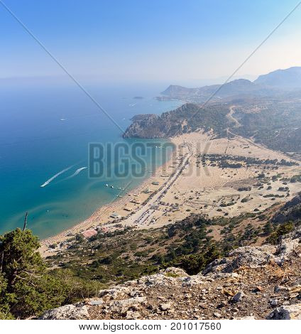 Aerial view on Tsampika sandy beach and lagoon with clear blue water at Rhodes island, Greece.