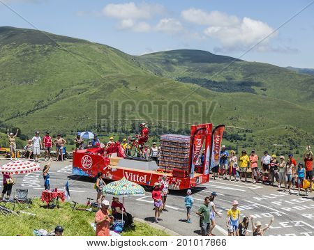 Col de PeyresourdeFrance- July 23 2014: Vittel vehicle during the passing of the Publicity Caravan on the road to Col de Peyresourde in Pyrenees Mountains in the stage 17 of Le Tour de France on 23 July 2014.Vittel is a French bottled water brand.