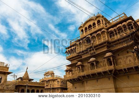 Wide angle picture of the amazing Jaisalmer Palace Museum carved yellow sandstone architecture in Jaisalmer known as Golden City in India.