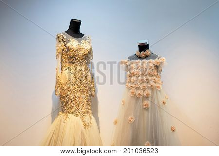 Set of wedding dress gown mom and kids daughter on mannequin in bridal gown. Bride's morning wedding preparation concept