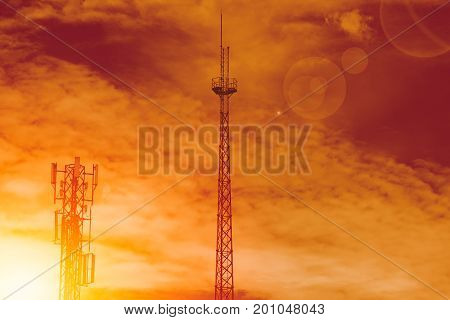 wireless network communication tower shilhouette orange sunset sky