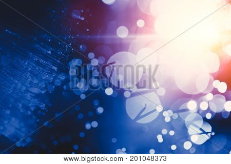Blur light bokeh of optical fiber innovation data transfer technology blue color tone