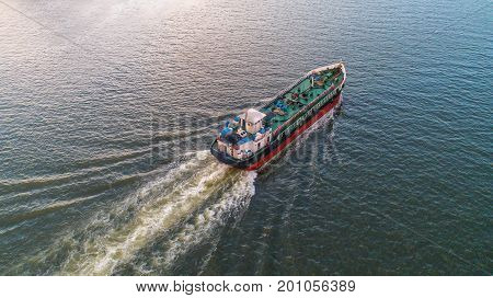 oil tanker gas tanker in the high sea.Refinery Industry cargo ship. top view aerial view Thailand in import export LP Goil refinery Logistics and transportation with working crane bridge in harbor