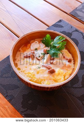 Banosh - Ukrainian Hutsul meal - maize porridge - with bacon, cracklings and cheese.