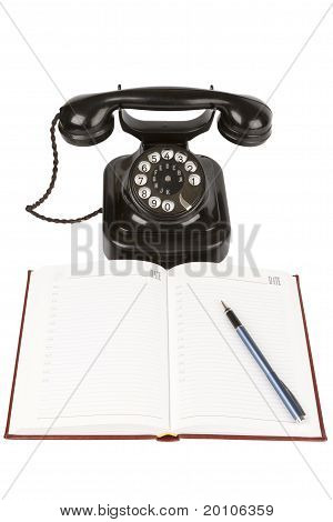 Vintage czarny telefon, organizator i pióra