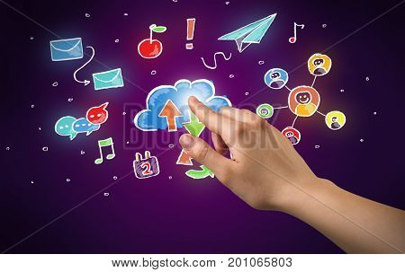 Female hand toucing mixed media icons with purple background