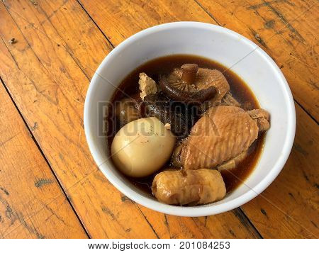 Stewed Pork With Herb, Egg And Wing Chicken  In Soy Sauce Or Sweet Brown Gravy (moo Pa-lo) In White