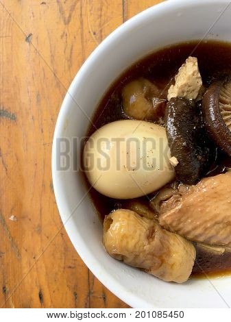 Stewed Pork With Herb, Egg And Wing Chicken  In Soy Sauce Or Sweet Brown Gravy (moo Pa-lo) In White