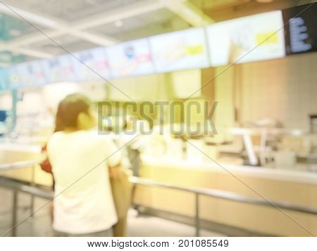 Blurred Image Of People Queue Up Waiting In Line To Buy Fast Food In Fastfood Store Or Seflservice R