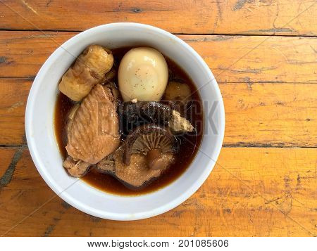 Stewed Pork With Herb, Egg And Wing Chicken  In Soy Sauce Or Sweet Brown Gravy (moo Pa-lo) In White