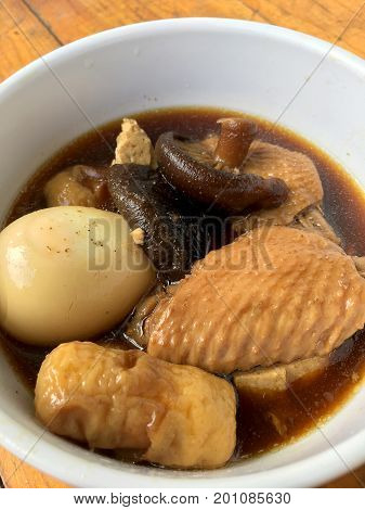 Stewed Pork With Herb, Egg And Wing Chicken  In Soy Sauce Or Sweet Brown Gravy (moo Pa-lo) In White