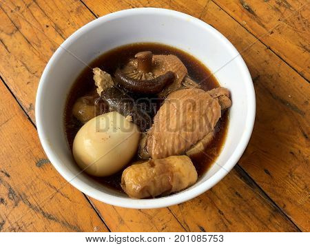 Stewed Pork With Herb, Egg And Wing Chicken  In Soy Sauce Or Sweet Brown Gravy (moo Pa-lo) In White