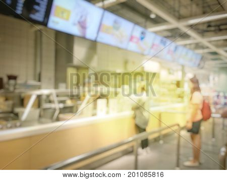 Blurred Image Of People Queue Up Waiting In Line To Buy Fast Food In Fastfood Store Or Seflservice R