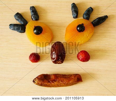 Edible man from dried apricots, currants, dates, dried banana, honeysuckle, strawberries