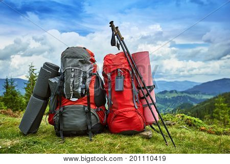 Backpacks in the mountains with views of the mountains.