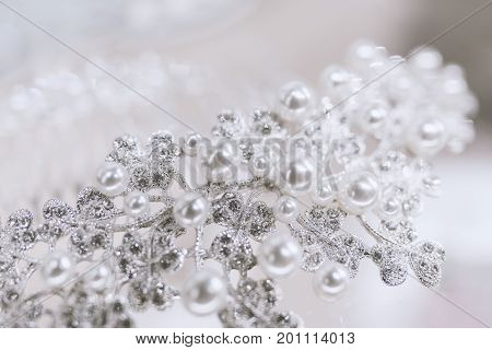 Jewel with pearls and diamonds on a white background