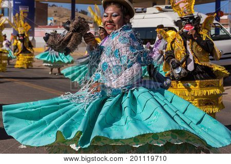 PUNO, PERU - AUGUST 07: Authentic Colorful Carnival on the streets of Puno, Peru near the high altutude Titicaca lake on August 7th, 2017