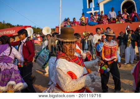 PUNO, PERU - AUGUST 07: Authentic Colorful Carnival on the streets of Puno, Peru near the high altutude Titicaca lake on August 7th, 2017