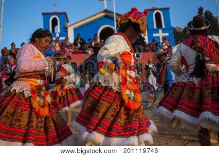 PUNO, PERU - AUGUST 07: Authentic Colorful Carnival on the streets of Puno, Peru near the high altutude Titicaca lake on August 7th, 2017