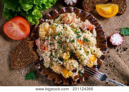 Homemade Fresh Couscous salad with tomatoes in plate