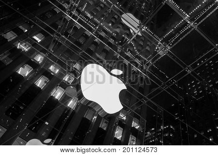 NEW YORK CITY - Dec 16, 2010:  Apple Store cube on 5th Avenue. Apple logo at Apple store on 5th ave. the glass front of the store looking up at logo in Manhattan, Dec 16, 2010 in New York City, USA.