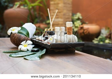 Spa massage compress balls herbal ball on the wooden with treaments spa Thailand select focus