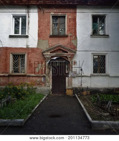 Kazakhstan, Ust-Kamenogorsk - 01, August 2017. Old house. Front door in old house. Architecture. Ancient architecture. Architectural background. Door. Front door. Old door.