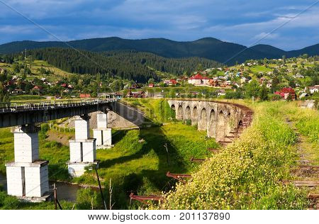 Old and new railway bridges, old viaduct Vorohta, Ukraine. Carpathian Mountains, wild mountain landscape