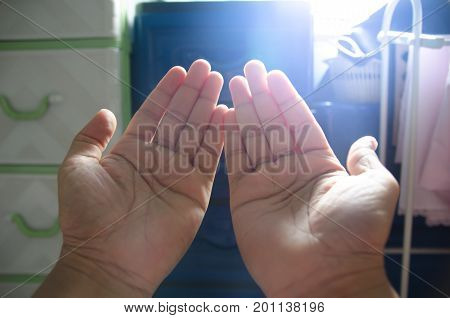 hands praying from god prayer hand for charity blured picture selective focus silhouette