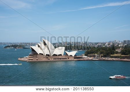SYDNEY,NSW,AUSTRALIA-NOVEMBER 20,2016: Sydney Opera House at Bennelong Point with jet boat, sailboats and cruise tour in Sydney, Australia