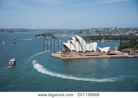 SYDNEY,NSW,AUSTRALIA-NOVEMBER 20,2016: Sydney Opera House at Bennelong Point with nautical vessels in Sydney, Australia