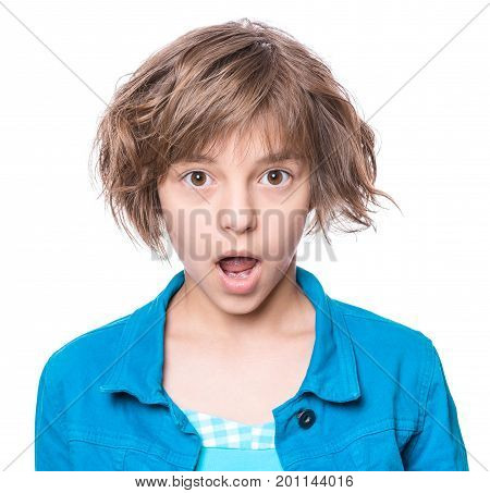 Emotional portrait of excited little girl. Funny cute surprised child 10 year old with mouth open in amazement. Portrait of shocked teenager, isolated on white background.