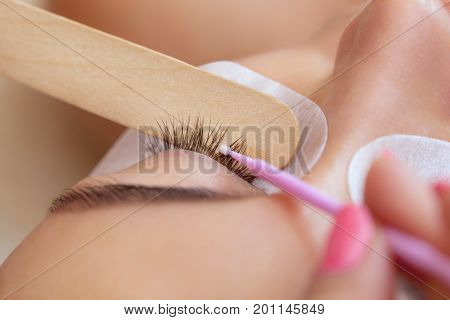 Eyelash Removal Procedure Close Up. Beautiful Woman With Long Lashes In A Beauty Salon. Eyelash Exte