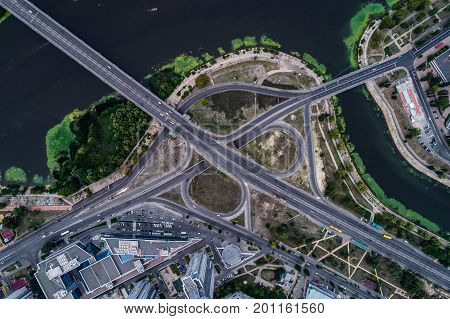 Fragment of the road junction in Kiev near the residential area of Rusanovka. Aerial view. From above