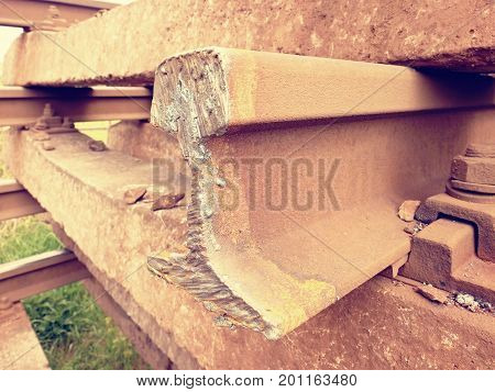 Cut Rusty Rails. Stock Of Steel Rails At Old Closed Railway Station. Transport To Steel Foundry For